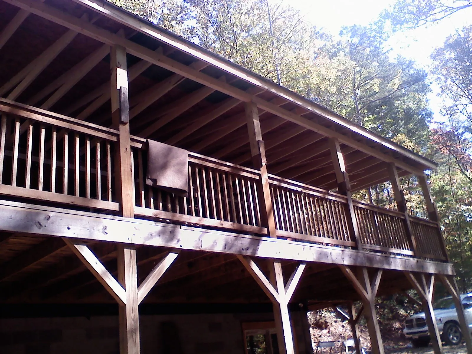 Timber framing under a new elevated porch and deck — Roof Leak Repair in Stout by Roofing Brothers